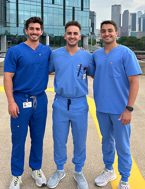 Dr. Altaher with two other dentists