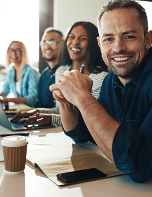 Group of professionals smiling at work 