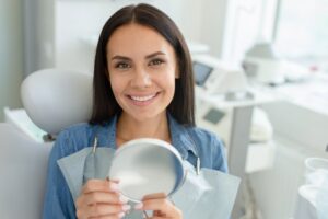 Woman smiling after getting veneers